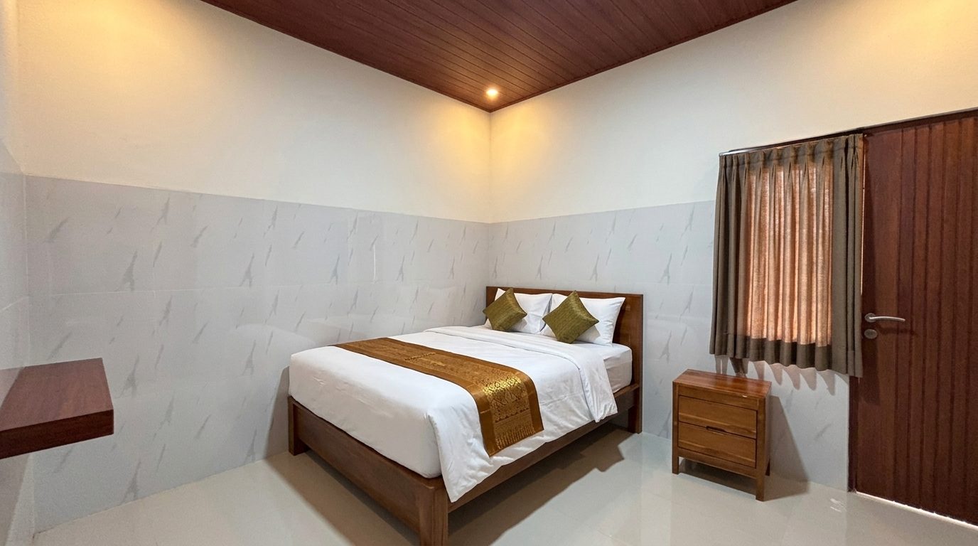 Kamar Studio Deluxe Yka Residence Jimbaran — ilustrasi staging dari foto asli (sprei & bantal ditambahkan)